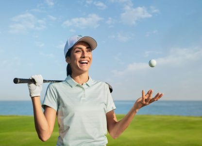 lady with golf ball at Al Mouj Golf